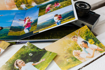 Family photos archive saved in brightly designed photo book; bright summer memories placed in the photobook.