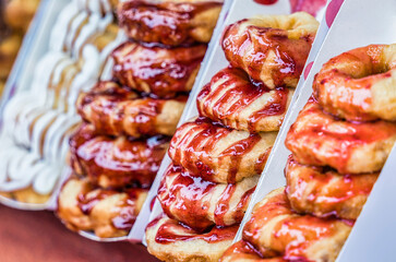 Juicy delicious glazed mini donuts sweets.