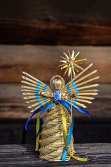 amulet in the form of an angel woven from straw