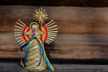 amulet in the form of an angel woven from straw