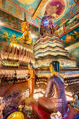 Wat Phnom Daun Penh,Buddhist temple interior,artwork and symbolic statues,next to the altar,Phnom...