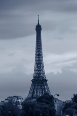 Eiffel Tower in Paris against clouds at evening