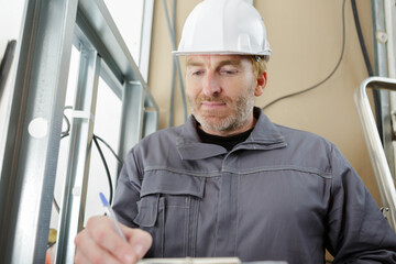 construction worker worker overall with clipboard