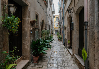 A narrow street among the old houses of Isernia, Italy - 593909292