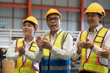 Manufacturing industrial concept. Asian male factory workers working and discuss at manufacturing production lines in factory during manufacturing process