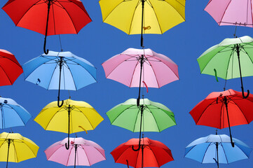 Multicolored umbrellas in the air