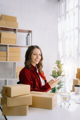 Fototapeta na wymiar woman start up small business owner SME or freelance America woman working with box at home office.