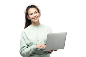 A woman using a laptop smiles and looks at the camera, transparent background.