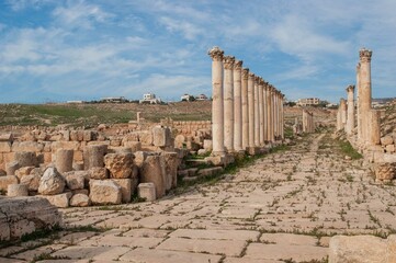 Jordan. Main street of Jerash is Cardo Maximus. Cardo Maximus is perfectly straight street with high columns along sides. Gerasa (Jerash) is ancient city that is six and half thousand years old.