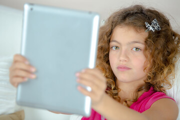 a young girl with tablet