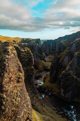 Vertical shot of a waterfall in the mountains