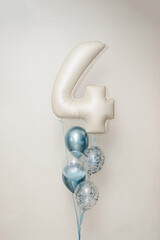 Helium white, blue air balloons decorated for a boy isolated on white background. Copy space....