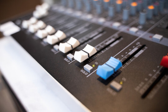 The console control panel of a large hi-fi system. audio equipment Closeup digital studio mixer control panel