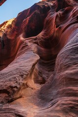 Red sandstone rocks at the Utah Canyons, with a blue sky and white clouds in the background