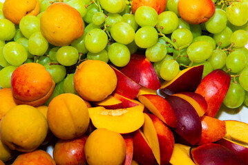 Fruits of peaches, nectarines and grapes