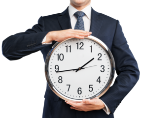 Businessman Holding a Clock in Front of the Face