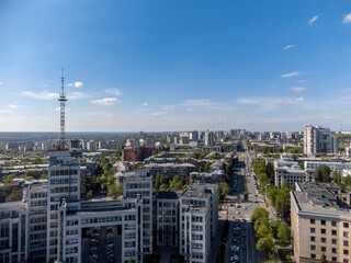 Naklejka premium Aerial view on Nauky Ave, street near Derzhprom with cars driving to Freedom Square in spring Kharkiv, Ukraine