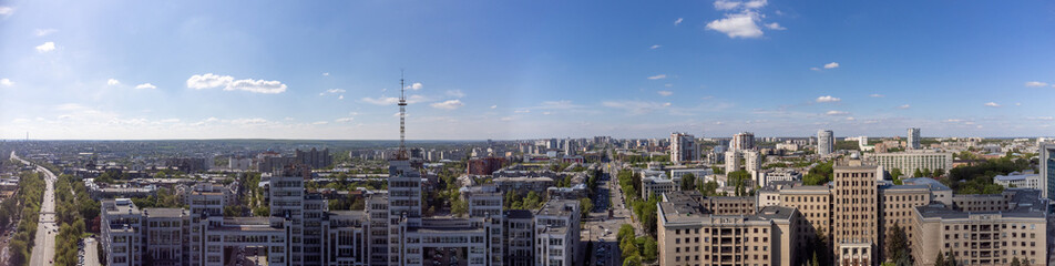 Fototapeta na wymiar Aerial panorama on Derzhprom and northern Karazin National University buildings on Freedom Square on blue sunny sky in Kharkiv, Ukraine