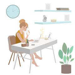 A young woman with a bun hairstyle sits at a table, works at a laptop and drinks coffee from a paper cup.