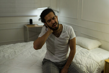 Fototapeta premium Young man sleeping bad and with neck pain