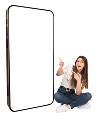 Happy caucasian teen woman demonstrating big smartphone screen. Blank white display huge mobile phone display mock up. Isolated white, full body size sitting girl. Transparent, png.