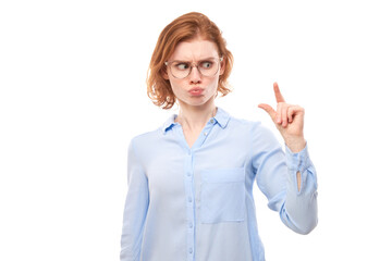 Portrait funny redhead young woman showing small size with fingers isolated on white studio background