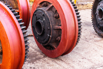 New steel wheels with gears for a harbor crane.