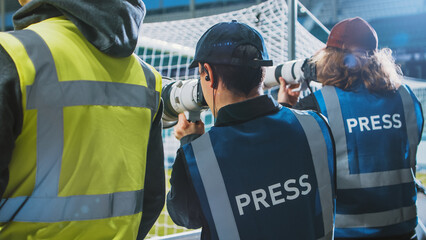 Professional Press Officer, Sports Photographers with Camera Zoom Lens Shooting Football Championship Match on Stadium. International Cup, World Tournament Event. Photography, Journalism, Media