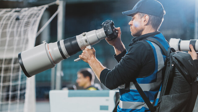 Professional Press Officer, Sports Photographers with Camera with Zoom Lens Shooting Football Championship Match on a Stadium. International Cup, World Tournament Event. Photography, Journalism, Media