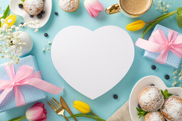 Happy mother's day trendy celebration concept. Top view flat lay of cupcakes, presents, coffee, tulips on pastel blue background. Blank heart for text or greeting
