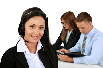 Businesswoman with Headset and Co-Workers In Background - Isolated