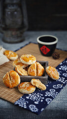 Sesame meat muffins, traditional handmade food, dark background(Translation: The word 