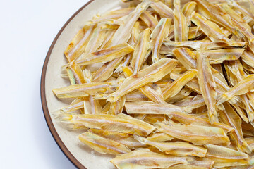 Dried anchovy on white background.
