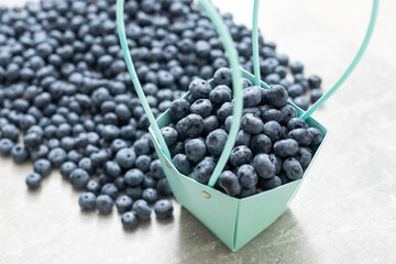 large blueberries in a green market basket