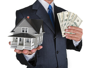 Bussinessman Holding Money and a Model House