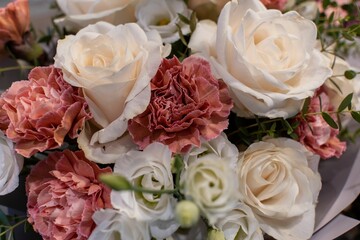 Closeup shot of the bouquet of flowers in nude colors