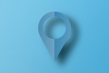 Light blue paper cut into placement pin shapes. pointer pad location mark Set on a light blue paper background.