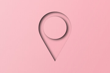 Pink paper cut into shapes, placement pins. pointer pad location mark set on pink paper background