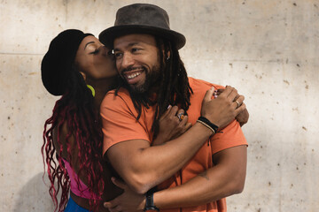 Portrait of African-American couple embracing each other. Smiling happy girlfriend and boyfriend...