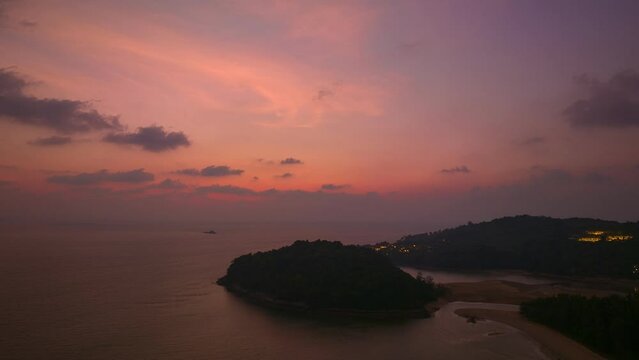 aerial hyperlapse view scenery sky in twilight above Kala island Layan beach Phuket..stunning sky at twilight at Kala island is at the endwise of Layan beach.Scene of Colorful romantic sky background.