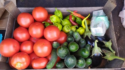 A wooden box full of homemade vegetables grown by the eco method