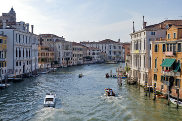 Obraz premium Venice, Italy: Panorama of Venice Grand Canal with boats and Santa Maria della Salute church on sunset from Ponte dell'Accademia bridge. Venice, Italy