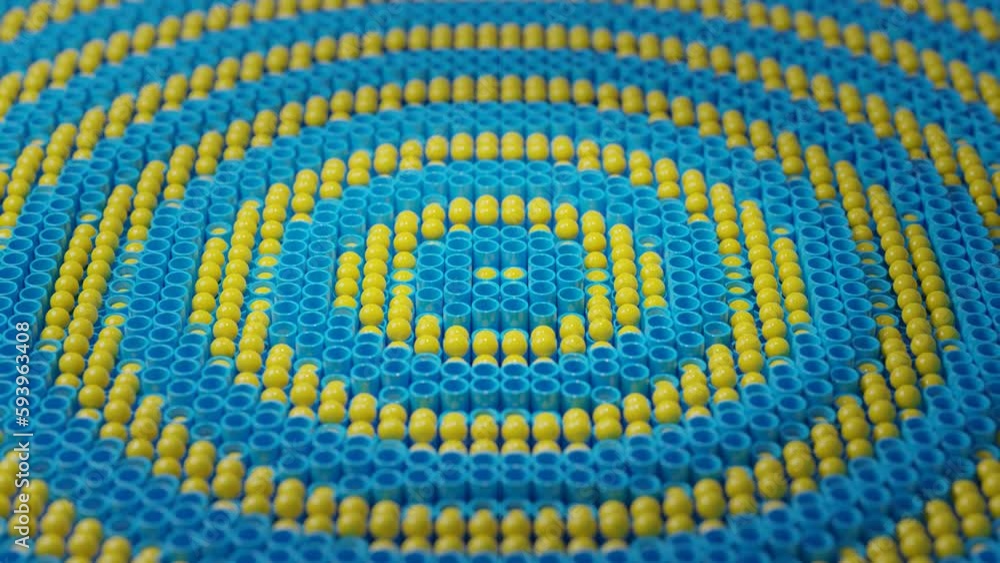 Poster loop 3d animation of an array of pipes and spheres. smooth undulating motion of spheres and cylinder
