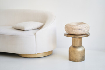 Part of a bright interior with a coffee table and a beige sofa. Stylish minimalism in the interior, natural materials,. High quality photo