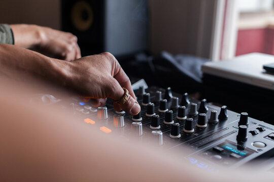 Couple of crop DJs playing music
