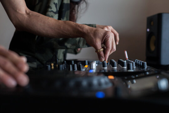 Couple of crop DJs playing music