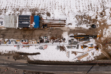 Drone photography of constructions site during winter day.