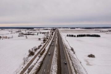 Drone photography of a highway going through rural landscape
