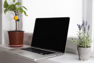 portable office desk with mock-up computer devices, supplies and decorations on white table