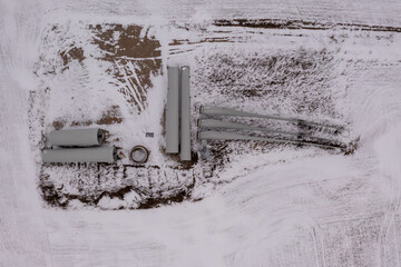 Drone photography of wind turbine parts in the middle of rural field
